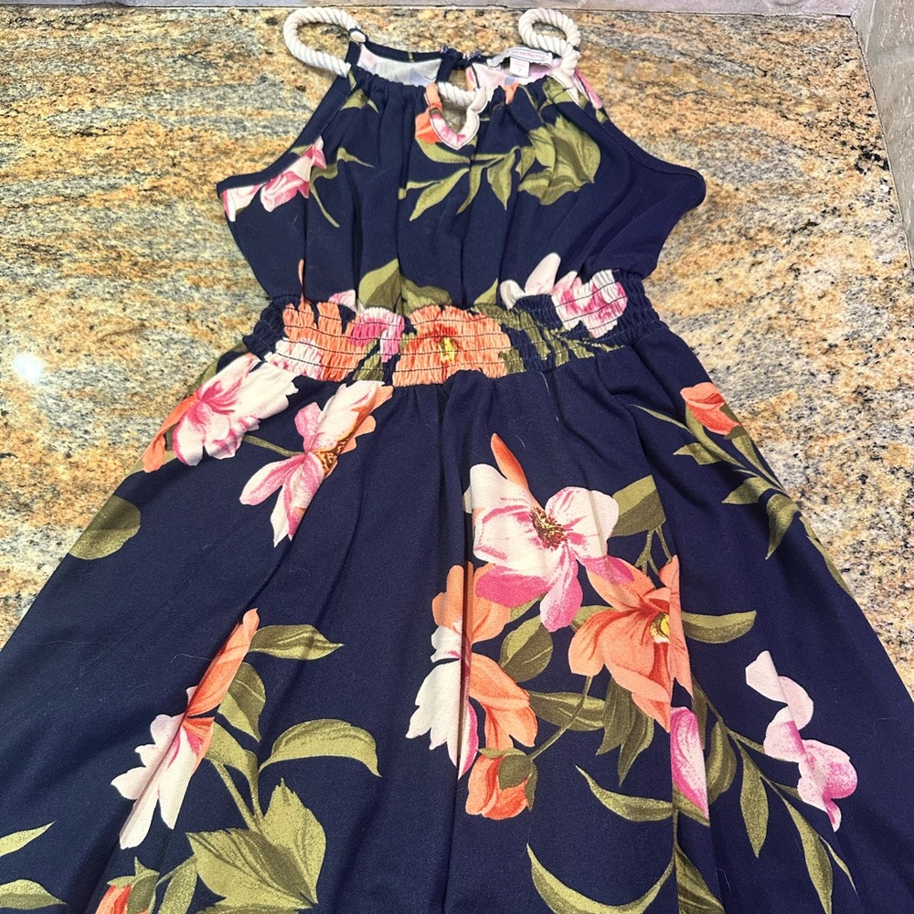 Floral soft dress with rope-woven shoulder straps.